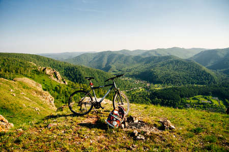 A trip by bike in mountain on the sunset. russia - sep, 2019のeditorial素材