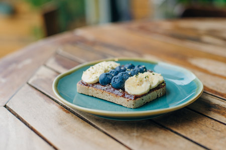 toast with chocolate paste, bananas and blueberriesの写真素材