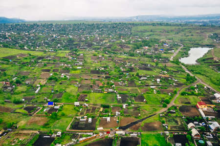 RUSSIA, krasnoyars - 13 JUN, 2020 Aerial view of cottages near the big wood. High quality photoの写真素材
