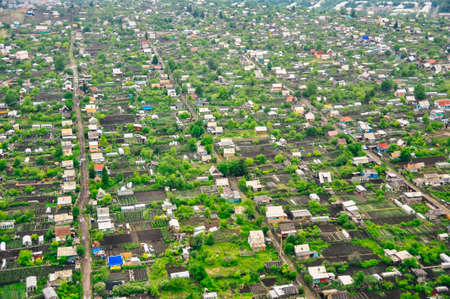 RUSSIA, krasnoyars - 13 JUN, 2020 Aerial view of cottages near the big wood. High quality photoの写真素材
