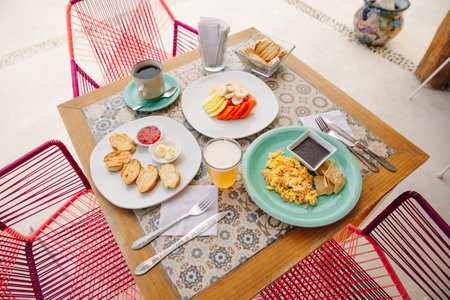 breakfast for two in the hotel with eggs, toast and fruit in mexicoの写真素材