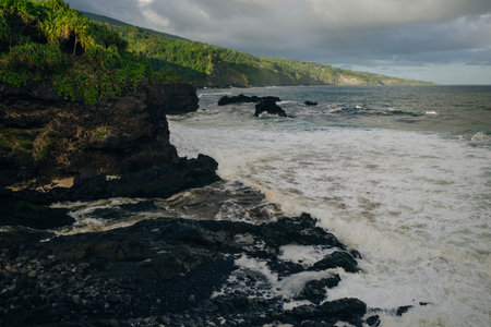Dramatic series of waterfalls of Ohe'o Gulch cascading down a rocky under a bridge, in Haleakala...