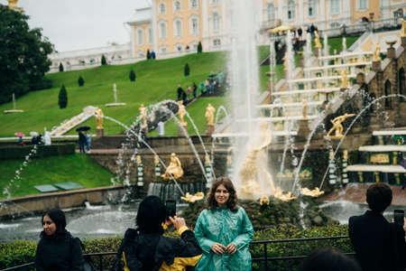 Peterhof, Russia: August, 2021 - the palace park. Tourists visiting the landmark of St. Petersburg. High quality photoのeditorial素材