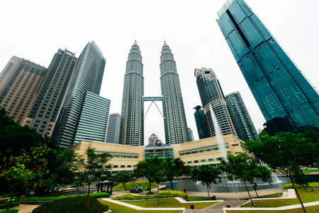 Kuala Lumpur, Malaysia - April, 2019 Petronas Twin towers panorama, Kuala Lumpur central park.