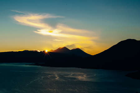 view of San Juan La Laguna on Lake Atitlan on sunriseの写真素材