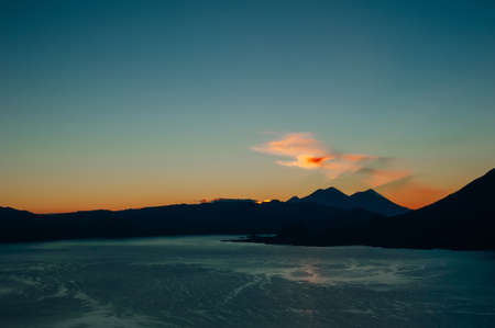view of San Juan La Laguna on Lake Atitlan on sunriseの写真素材