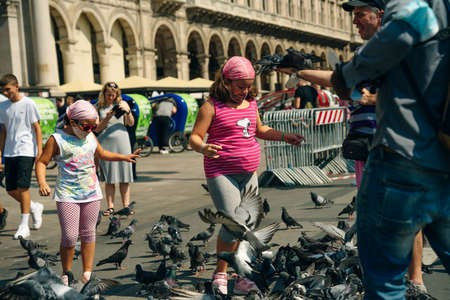 MILAN - NOV, 2021: Tourists visit Piazza Duomo in Milan, Italyのeditorial素材