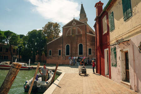 Vibrant houses along a boat lined canal in Burano, Venice, Italy. High quality photoのeditorial素材