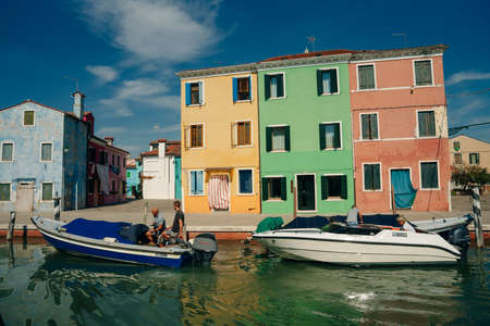 Burano, Italy - Nov, 2021 View of the colorful Venetian houses along the canal. High quality photoのeditorial素材