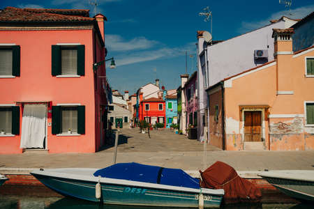Vibrant houses along a boat lined canal in Burano, Venice, Italy. High quality photoのeditorial素材