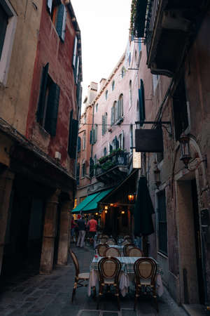 View of old narrow street in Venice, Italy. Architecture and landmark of Italy. Cozy cityscape of Rome. High quality photoのeditorial素材