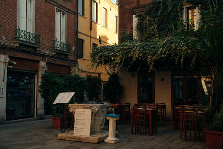 View of old narrow street in Venice, Italy. Architecture and landmark of Italy. Cozy cityscape of Rome. High quality photoのeditorial素材