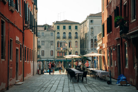View of old narrow street in Venice, Italy. Architecture and landmark of Italy. Cozy cityscape of Rome. High quality photoのeditorial素材