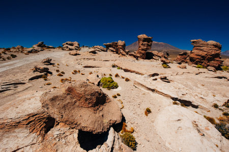 reddish rock formations in desert morning sun, bolivia.の写真素材