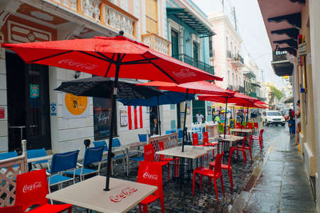 red umbrellas of a restaurant in the center of san juan, puerto rico - dec, 2021. High quality photoのeditorial素材