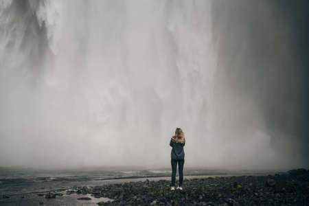 The Skogarfoss waterfall in southern Iceland with tourists. High quality photoの写真素材