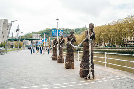 bilbao, spain - dec, 2021 Las Sirgueras, the women pulling the boats through a towline. High quality...