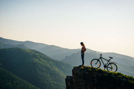 A trip by bike in mountain on the sunset. russia - sep, 2019.の写真素材