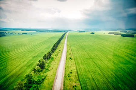 aerial view of the road through the fields. high quality photo