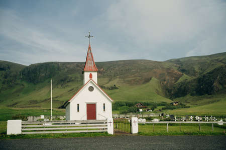 Beautiful Red Church on a Mountain Top at Vik, Iceland. high quality photoのeditorial素材
