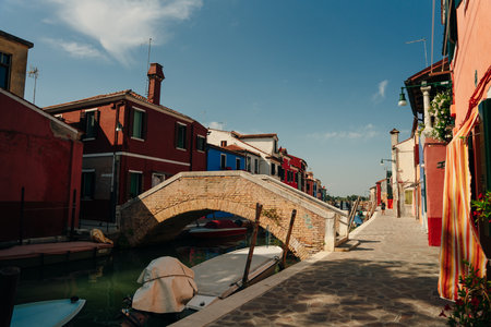 BURANO, ITALY - nov, 2021 Burano island with beautiful multi colored houses and a group of tourist...