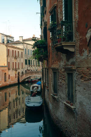 Italy - nov, 2021. The cityscape and architecture of Venice. Urban canal and boats on it. high quality photoのeditorial素材