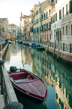 Italy - nov, 2021. The cityscape and architecture of Venice. Urban canal and boats on it. high quality photoのeditorial素材