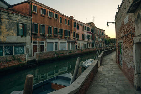 Italy - nov, 2021. The cityscape and architecture of Venice. Urban canal and boats on it. high quality photoのeditorial素材