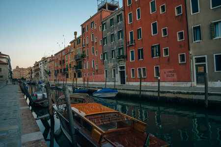 Italy - nov, 2021. The cityscape and architecture of Venice. Urban canal and boats on it. high quality photoのeditorial素材