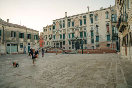 Italy - nov, 2021. The cityscape and architecture of Venice. Urban canal and boats on it. high quality photoのeditorial素材