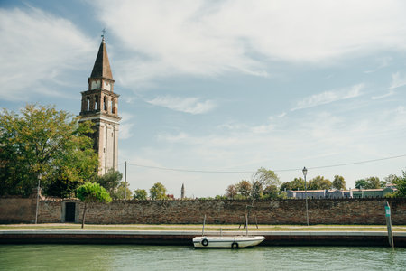 View of the San Michele Arcangelo bell tower and the colorful houses of Mazzorbo, Venice - Sep, 2021. High quality photoのeditorial素材