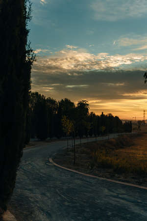 Pilgrims walking through endless green fields under sunrise. high quality photoの写真素材