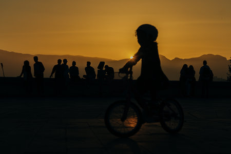 silhouettes of people on the background of the sunset. high quality photoの写真素材