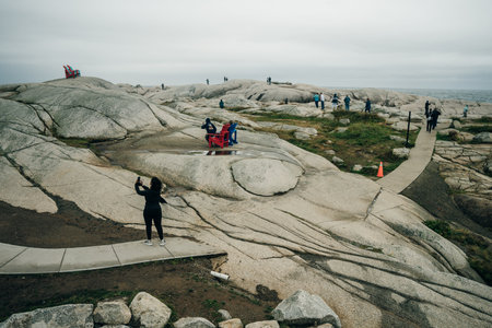 Scituate Harbor lighthouse overlooks a breakwater in Massachusetts - Oct, 2022. High quality photoのeditorial素材