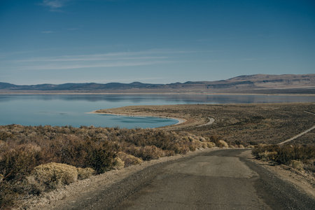 Tufa columns reflected in the mirrored water surface at Mono Lake, California. high quality photoの写真素材