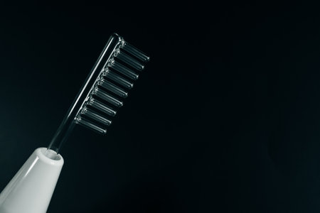 darsonval on black background, closeup. Space for text. high quality photoの写真素材