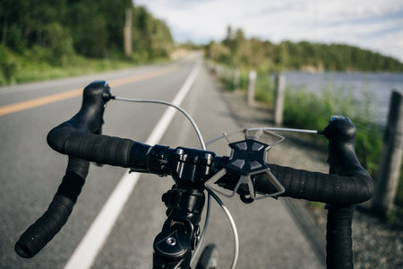 Personal perspective of a cyclist riding a road bicycle on the road. high quality photoの写真素材