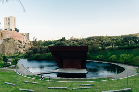 La Mexicana, Santa Fe, Mexico City - april 2023, modern urban park with articicial lake and red auditorium. high quality photoのeditorial素材