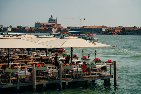 restaurant on the water in venice, italy - may 2023. High quality photoのeditorial素材