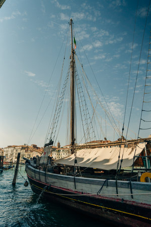 canal with empty gondolas in venice, italy - may 2023. High quality photo