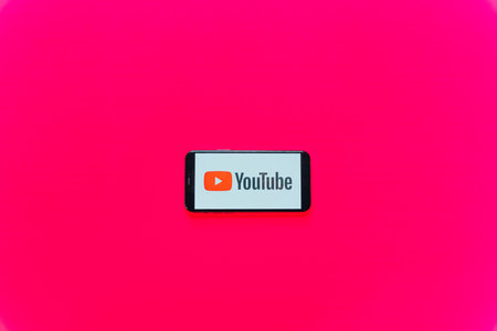 phone screen with youtube logo in pink background. Calgary, Canada. high quality photoのeditorial素材