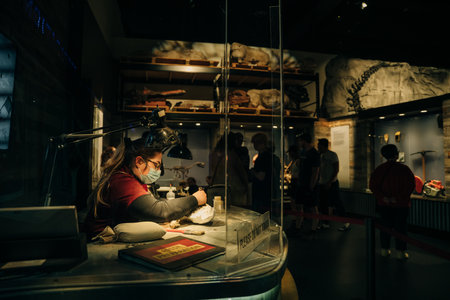 Drumheller, Canada - Mar 2023 Visitors flock to the dinosaur exhibits at the entrance of the Royal Tyrrell Museum. high quality photoのeditorial素材