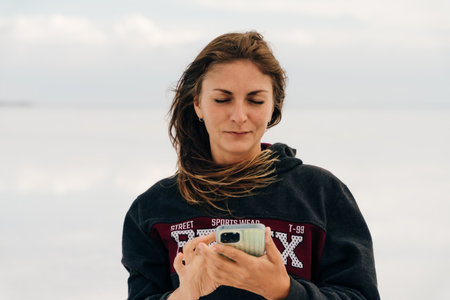 girl taking a selfie on the lake. high quality photo