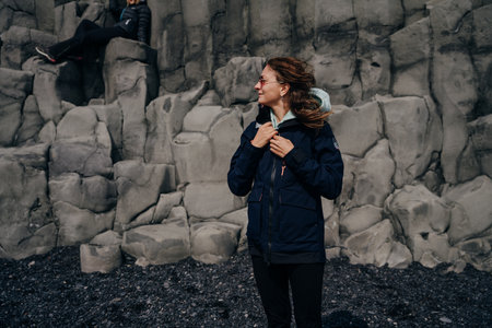 traveler on halsanefshellir cave, Reynisfjara, Iceland. high quality photoの写真素材