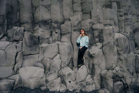 traveler on halsanefshellir cave, Reynisfjara, Iceland. high quality photoの写真素材
