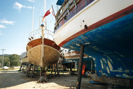 ships stand on the shore out of season for painting and repairs. high quality photo