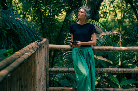 girl stands on the background of tropical trees. high quality photoの写真素材