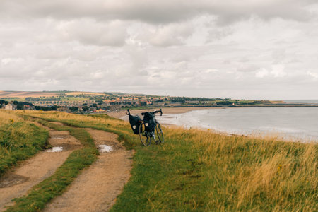 Traveler on bicycle. Solo travel long distance bicycle touring concept. High quality illustrationの写真素材