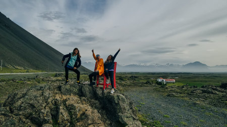 tourists on The Red Chair in Iceland on a Summer Dayの写真素材