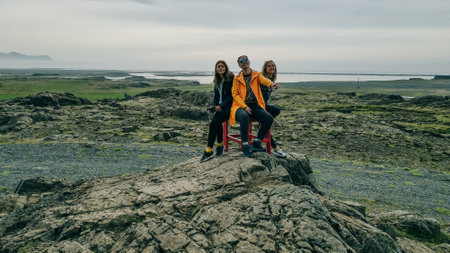 tourists on The Red Chair in Iceland on a Summer Dayの写真素材